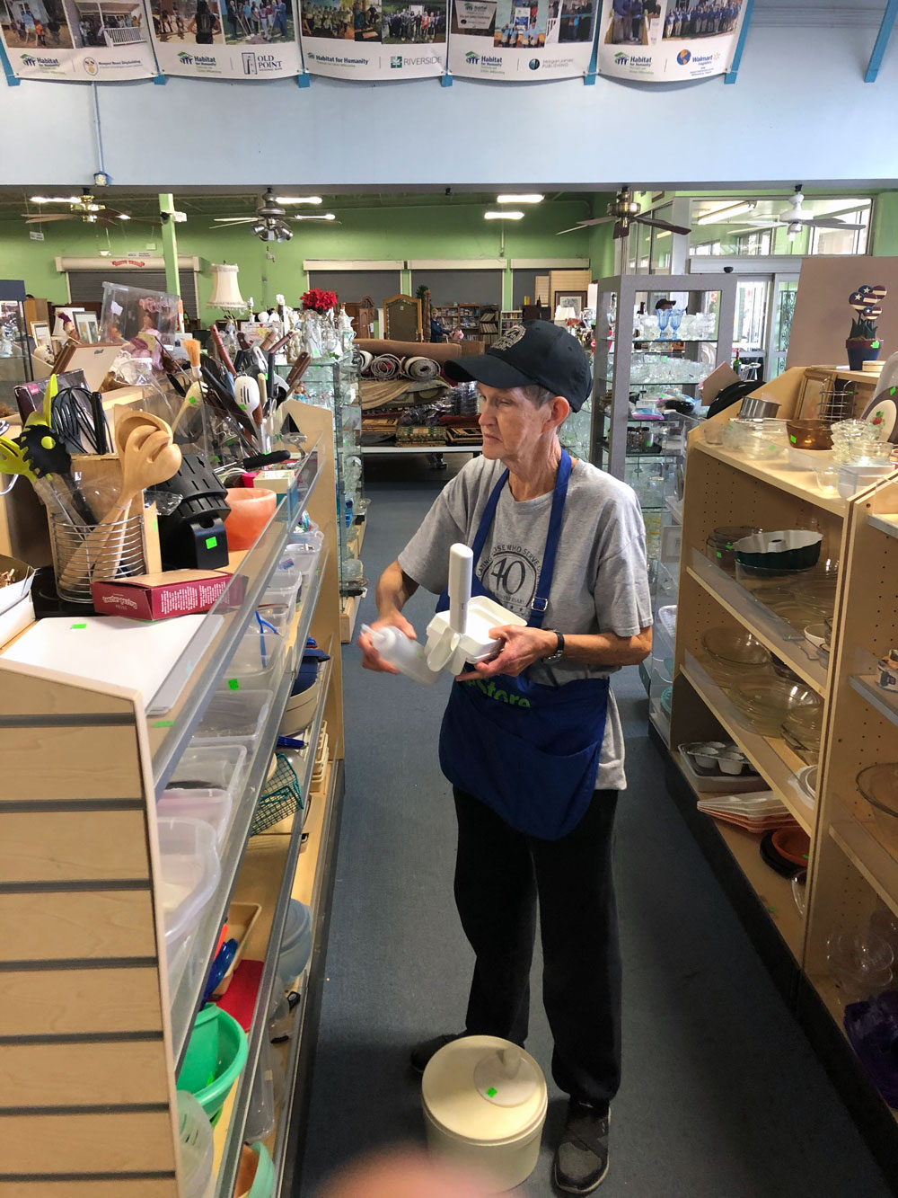 Blanche-Cookie-Allen-arranges-items-at-the-Habitat-for-Humanity-ReStore-in-Newport-News-